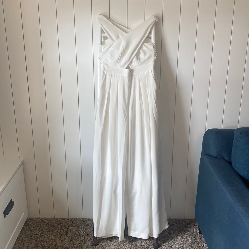 White cross-cross neckline Asos jumpsuit. New with tags, size 10.